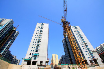 Unfinished high-rise buildings and tower crane