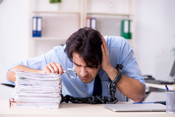 Naklejka premium Young male businessman employee unhappy with excessive work 