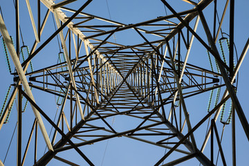 High voltage tower from below with symmetric view frame