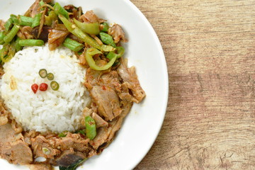 spicy stir fried duck meat curry on rice in plate