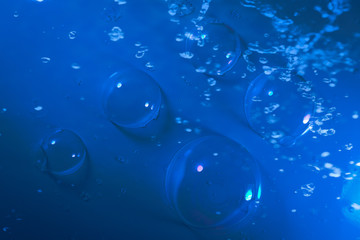 Beautiful abstract close up blue and purple bubbles water background and wallpaper