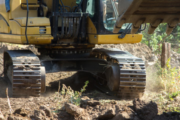 bucket and mechanical arm of the excavator in motion