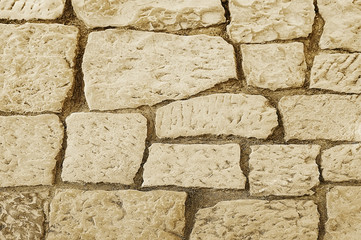 Old beige stone pavement background