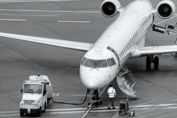 Fototapeta premium an airplan on an airport from above in black and white