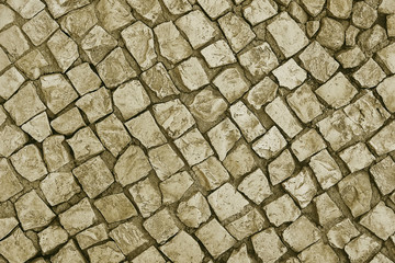 Old beige stone pavement background