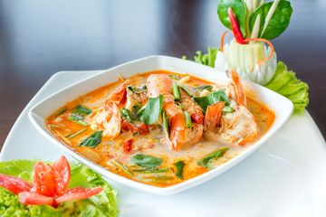 Tom Yum Koong (Thai Language) is prawn and lemon grass soup with mushrooms the famous delicious Thai food.