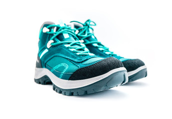 A pair of hiker green mountain sport boots, isolated on white background.
