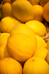 yellow melons pile in a box