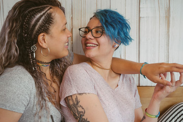 Women with tattoo skin showing a lesbian relationship.