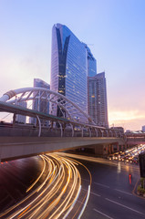Fototapeta premium View of high buildings and public sky walk for transit between Sky Transit and Bus Rapid Transit Systems at Sathorn-Narathiwas junction