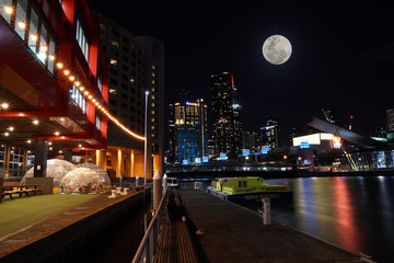 Fototapeta na wymiar moon over Melbourne CBD illustration