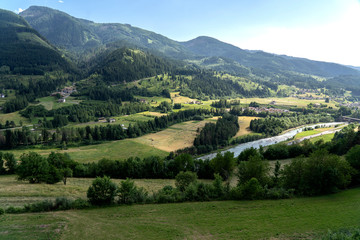 Obraz premium Overview summer of Cavalese in the Trentino Alps. Dolomiti, Trentino Alto Adige, Italy. Shot taken from Cavalese, Val di Fiemme. Panorama on the Dolomites Mountains. River Avvisio in Cavalese.