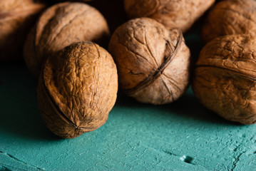 walnuts on blue wooden table background