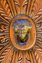 Fototapeta na wymiar Detail of the vintage door knocker from Montalcino, Italy