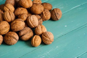 walnuts on blue wooden table background