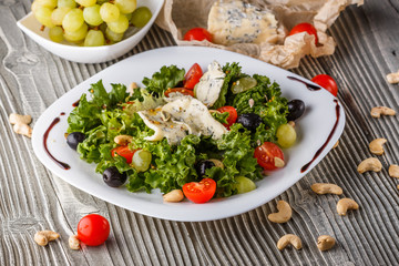 salad provence with blue cheese on wooden table