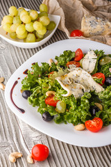 salad provence with blue cheese on wooden table