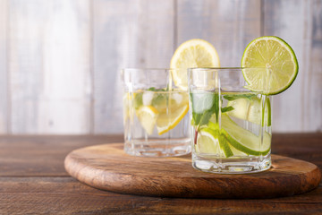 Close-up of homemade detox lemonade with lime, mint and ice, cleansing the body