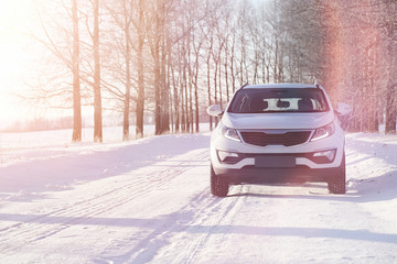 White car on a winter road