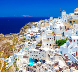 Santorini island, Greece, Oia village with windmills and colorful houses