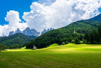 Fototapeta na wymiar Scenic view of St Johann Church. Santa Maddalena village, Dolomites, Val di Funes, Italy.