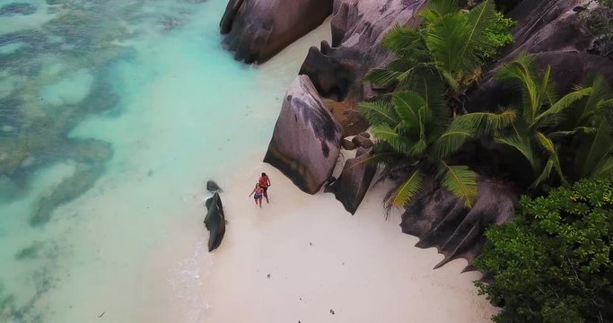 Aerial Ascending: Walking on the Beach of Praslin Seychelles