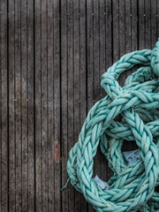 Sailing background -Blue grunge rope on wood background with copy space