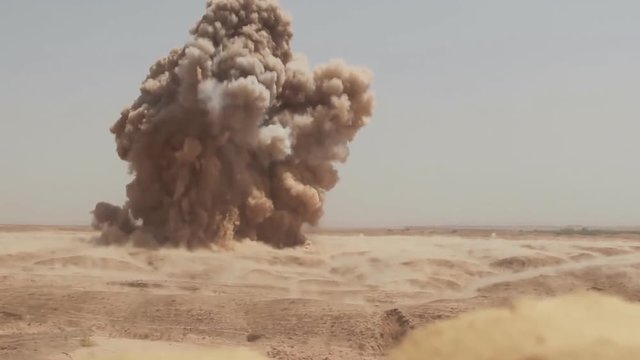 Disposal of an air bomb in the Syrian desert.