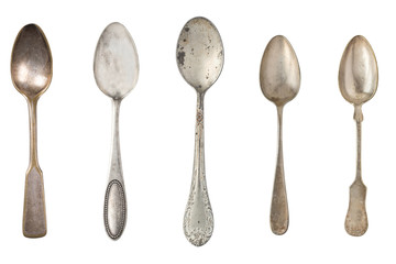 Vintage metal antique tea spoons isolated on a white background. Retro silverware.