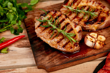 Steak pork grill on wooden cutting board