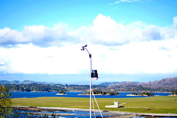 weather station in Norway on sea shore background