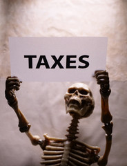 Skeleton with Tax Label