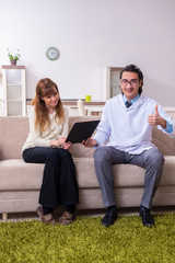 Obraz premium Young female patient discussing with male psychologist personal 