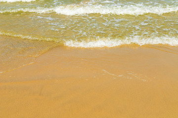 Soft beautiful ocean wave on sandy beach.