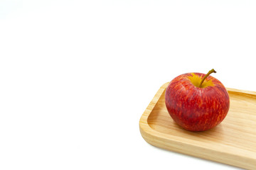 red apple on a plate isolated on white