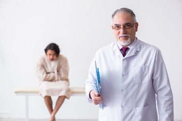 Aged male doctor psychiatrist examining young patient 