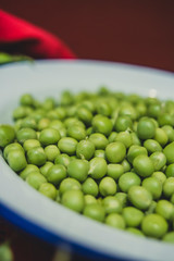 Organic green pea in a tin plate close up