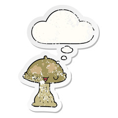 cartoon toadstool and thought bubble as a distressed worn sticker