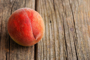 peach fruit on old weathered wooden table background
