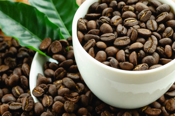 Coffee beans in coffee cup