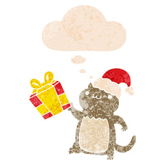 cute cartoon christmas cat and thought bubble in retro textured style