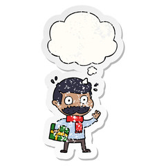 cartoon man with mustache and christmas present and thought bubble as a distressed worn sticker