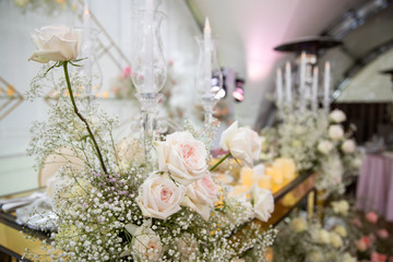 Wedding decorated table. Luxury light decor on table in restaurant