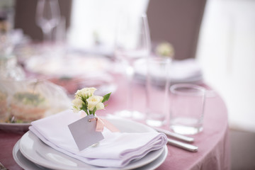 Wedding decorated table. Luxury light decor on table in restaurant