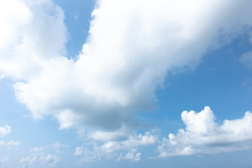 Nature Bright blue Sky with white clouds on blackground. Beautiful sky and clouds in the afternoon.