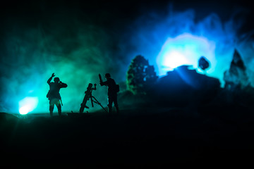 Naklejka na ściany i meble War Concept. Military silhouettes fighting scene on war fog sky background,