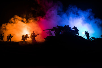 Fototapeta na wymiar War Concept. Military silhouettes fighting scene on war fog sky background,