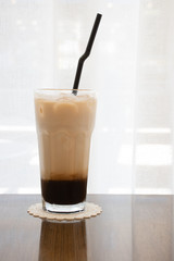 cup of coffee latte on wooden table