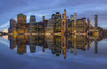 Panorama scene of New york Cityscape with Brooklyn Bridge beside the east river at the twilight time, Reflection concept, USA downtown skyline, Architecture and building with tourist concept