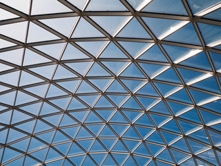 Glass roof against the blue sky.